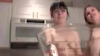 Cute little teen pisses into a cup